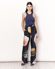 The Gemstone Pant features an elastic waistband and side pockets in our signature relaxed straight leg pant silhouette, offering an elevated yet comfortable style. It is crafted from a silky recycled Oeko-Tex® certified viscose in the opulent Gemstone Print, designed exclusively for Romy. Print placement will vary. Now available at Romy. 