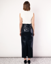 Our best selling, Maxi Suiting Skirt has been recut for Fall in a buttery soft vegan leather. It features belt loops and a back split for ease of wear. Now available at Romy. 