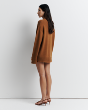 Ingrid Sweater: A relaxed V-neck knit crafted from a soft wool-cashmere blend. Features a slouchy fit with dropped shoulders and chunky ribbing for effortless, everyday comfort. Shop the look now.