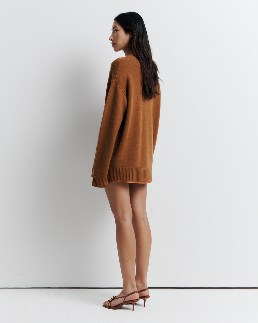 Ingrid Sweater: A relaxed V-neck knit crafted from a soft wool-cashmere blend. Features a slouchy fit with dropped shoulders and chunky ribbing for effortless, everyday comfort. Shop the look now.