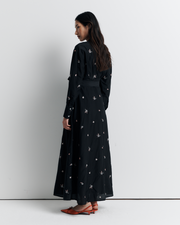 The Lola Shirt Dress is a lightweight, button-through shirtdress featuring pleated waist detailing, a removable belt, and delicate floral embroidery for a romantic, feminine finish.
