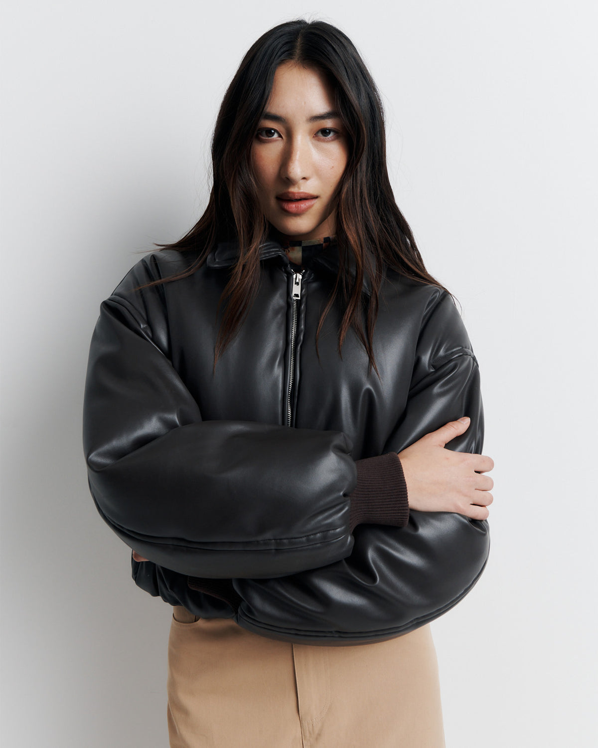 Padded Bomber Jacket in chocolate faux leather, front close-up on model.