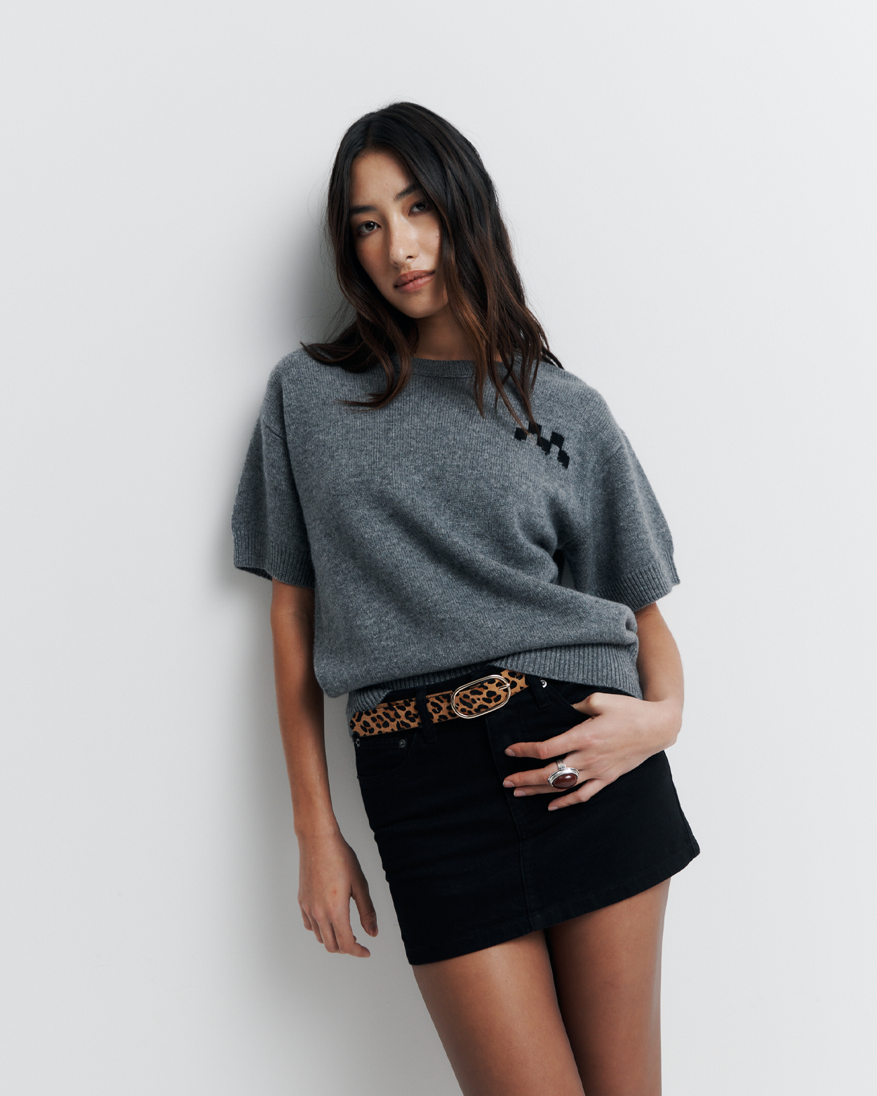 Shop the Cleo Short Sleeve Sweater made from a luxurious 90% wool and 10% cashmere blend. Featuring a relaxed fit, dropped shoulders, crew neck, and ribbed hem detailing, this lightweight, breathable sweater adds comfort and style to your wardrobe. Perfect for layering or wearing on its own.