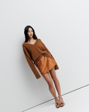 Ingrid Sweater: A relaxed V-neck knit crafted from a soft wool-cashmere blend. Features a slouchy fit with dropped shoulders and chunky ribbing for effortless, everyday comfort. Shop the look now.