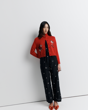 The Lara Cardigan is a fitted, collared knit featuring delicate floral motifs and a timeless button-front design—perfect for layering with a touch of vintage charm.