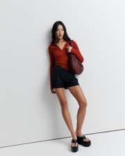 The Louise Knit Top in Red is a collared Henley-style knit featuring soft bust gathers, elongated sleeves for layering, and signature ‘R’ embroidery—an effortlessly polished wardrobe essential.