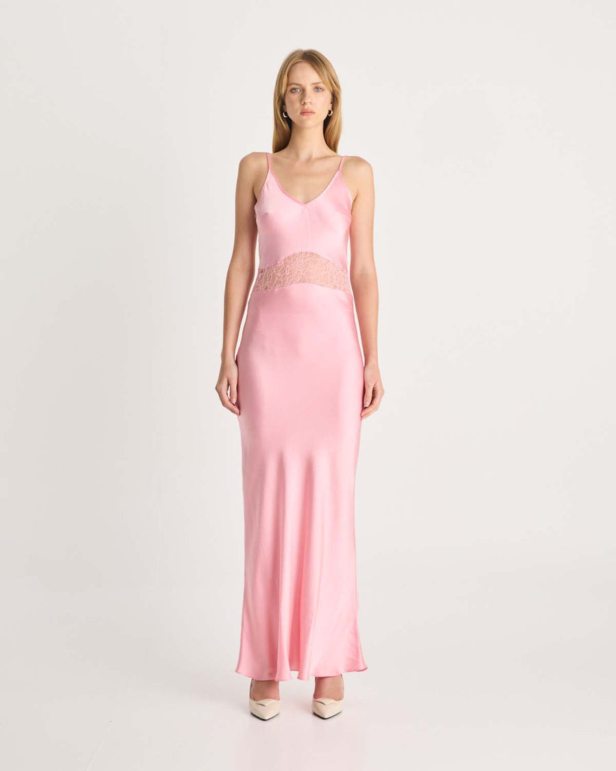 This stunning pink silk dress is designed to make a statement. Featuring intricate floral lace cut-out details that accentuate the waist, this dress is cut on the bias to softly skim the body, creating a flattering and feminine silhouette. Available exclusively at Romy and Coco and Lola. Shop online at Romy now with Afterpay and free express shipping available.