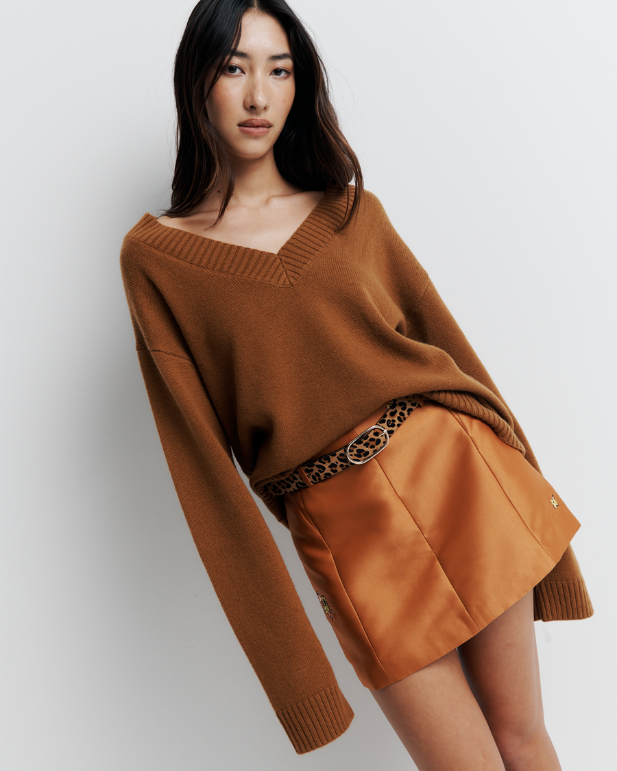 Ingrid Sweater: A relaxed V-neck knit crafted from a soft wool-cashmere blend. Features a slouchy fit with dropped shoulders and chunky ribbing for effortless, everyday comfort. Shop the look now.