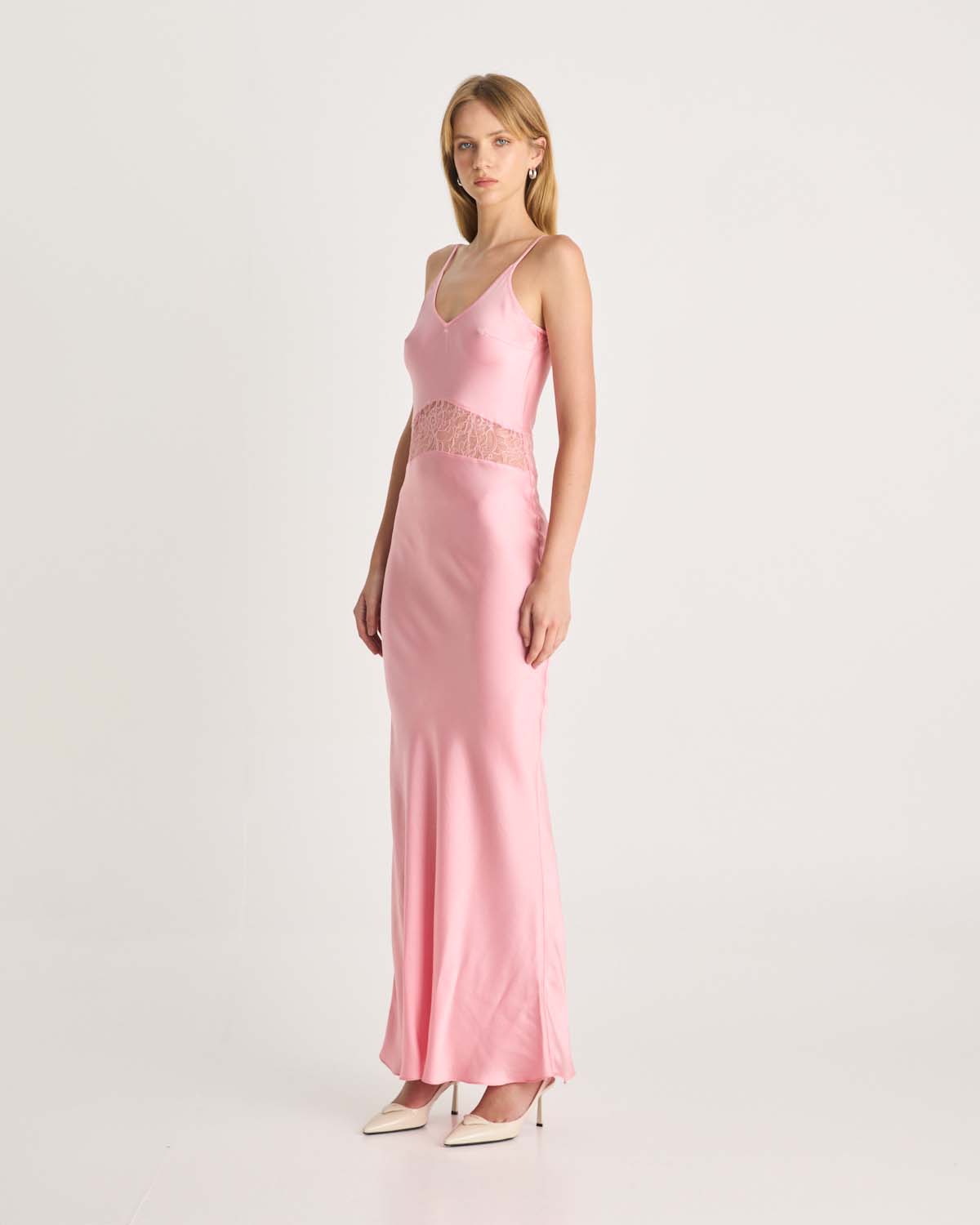 This stunning pink silk dress is designed to make a statement. Featuring intricate floral lace cut-out details that accentuate the waist, this dress is cut on the bias to softly skim the body, creating a flattering and feminine silhouette. Available exclusively at Romy and Coco and Lola. Shop online at Romy now with Afterpay and free express shipping available.