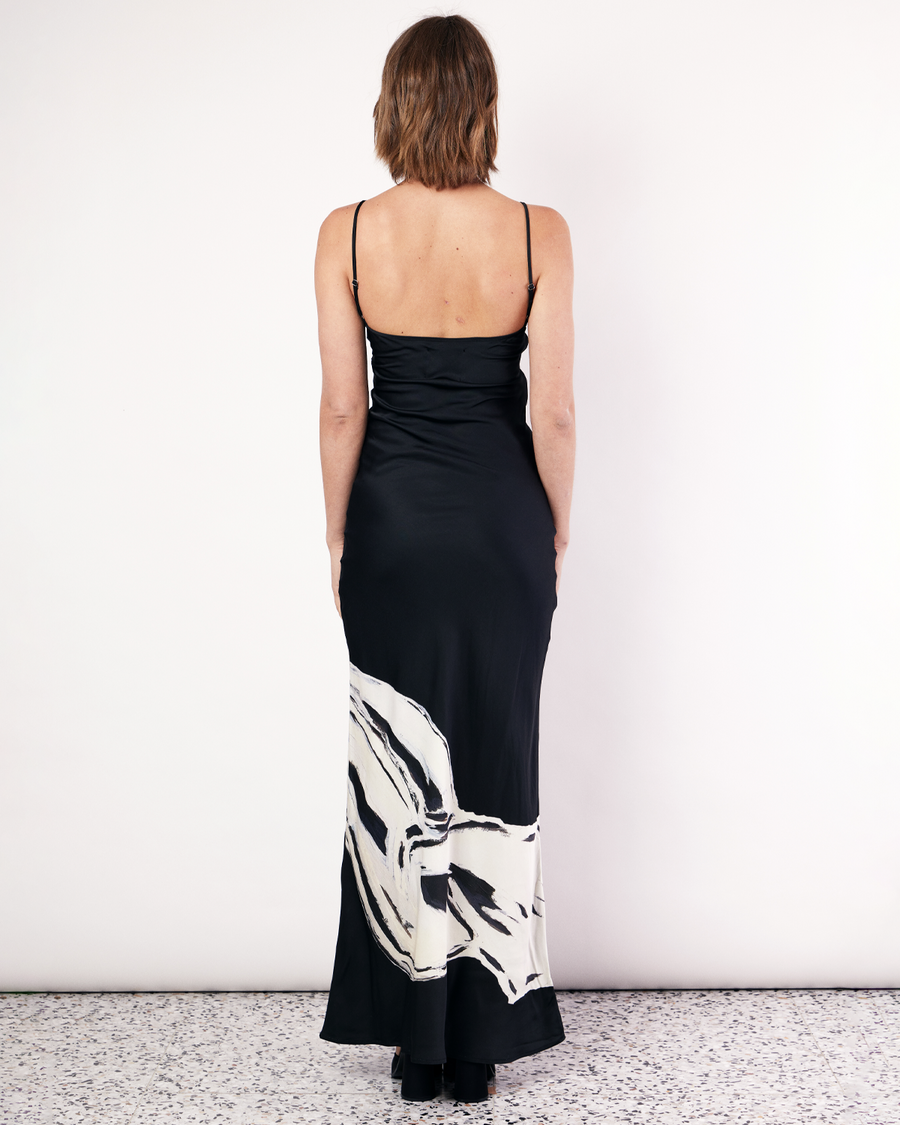 The Hip Hills Bias Cut Dress features our best-selling maxi silhouette that falls effortlessly against your natural curves with thin, adjustable straps. It is crafted from a silky recycled Oeko-Tex® certified viscose in the Hip Hills Print, designed in collaboration with Tasmanian artist, Shelley Bickerstaff, in Black and White. Now available at Romy. 