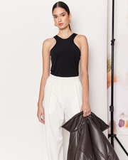 The Pleat Front Pant are a wardrobe staple, wide-leg pant in a light cream colourway. Crafted with a soft wool blend, these pants are fully-lined and non-sheer, featuring a hidden clasp closure, a slightly wide leg, two deep side pockets, and a pleated detail down the front to create a subtle draped silhouette. DETAILS:Main: 73% Polyester, 18% Rayon, 6% Wool, 3% SpandexLining: 96% Polyester, 4% SpandexMade in China CARE:Dry Clean Only. SIZE AND FIT:Model is size 8 and wearing a size S. By Romy. 