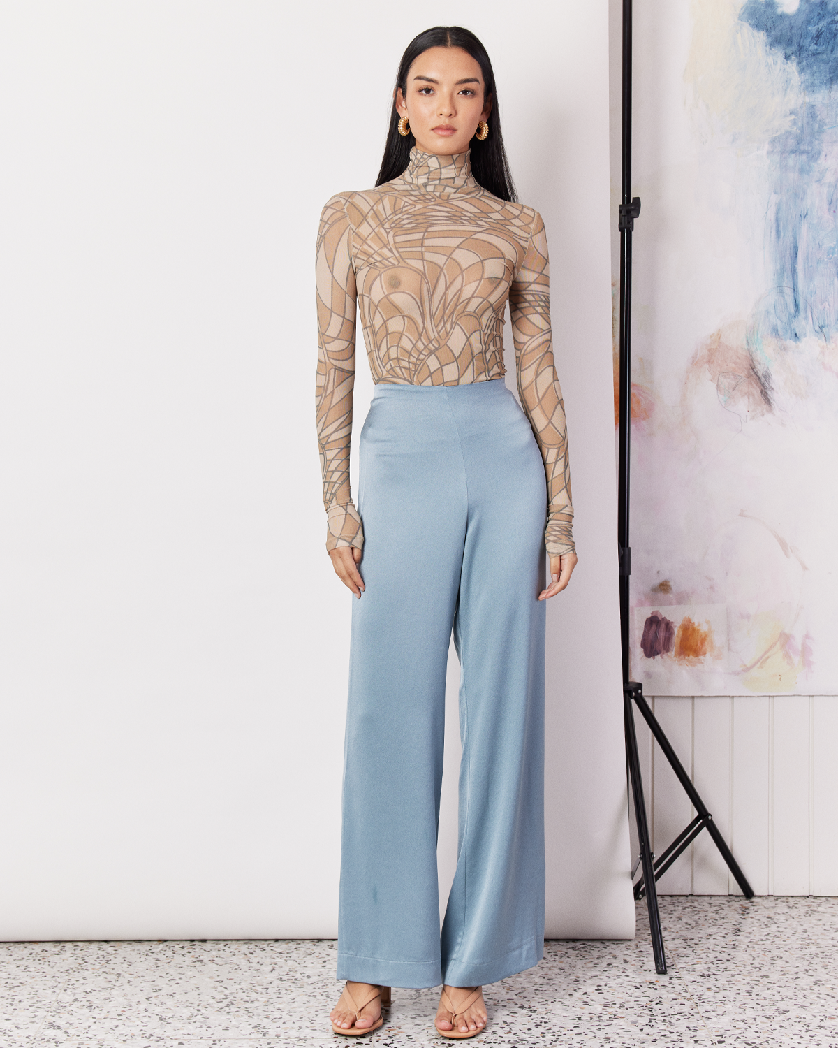 DESCRIPTION: The Fluid Satin Pants are a loose fitting pant featuring a high waist with an elastic detail making them comfortable to wear all day long. DETAILS:80% Acetate, 20% PolyesterMade in China CARE:Dry Clean Only. SIZE AND FIT:Model is between a size 6 and 8 and wearing a size XS. By Romy. 