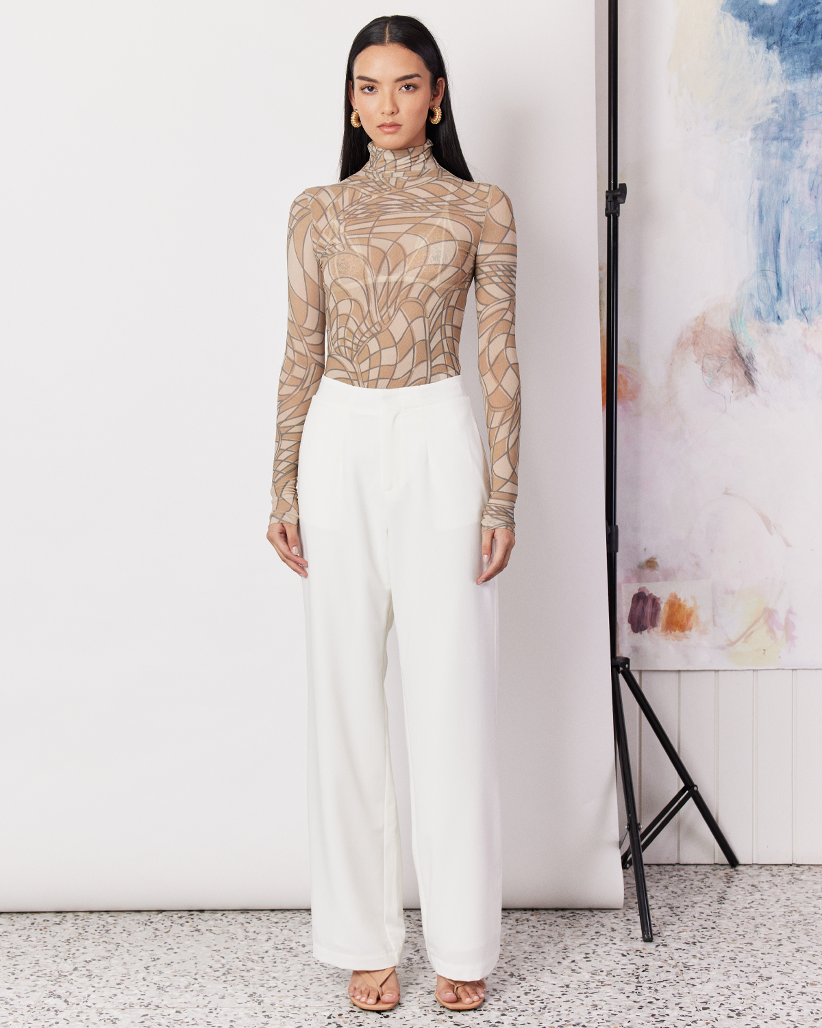 The Tailored Pant are an easy-wearing and versatile cream pant in a relaxed straight leg silhouette. Crafted with a soft wool blend, these pants are fully-lined, featuring a mid-waist rise, a hidden clasp closure, and an elasticated back for ease and comfort. These versatile white tailored pants are the perfect addition to your wardrobe.