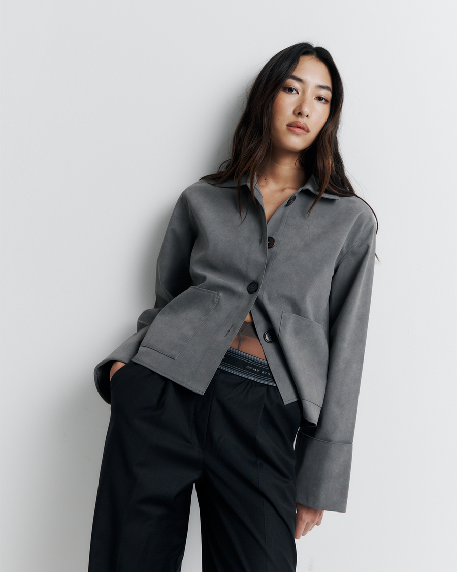The Gabbi Jacket is a relaxed-fit outerwear piece crafted from soft vegan suede with a contrast pink twill lining. Designed with patch pockets, turn-back cuffs, and a four-button closure for effortless everyday style.