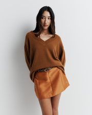 Ingrid Sweater: A relaxed V-neck knit crafted from a soft wool-cashmere blend. Features a slouchy fit with dropped shoulders and chunky ribbing for effortless, everyday comfort. Shop the look now.