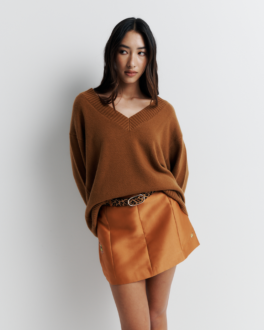 Ingrid Sweater: A relaxed V-neck knit crafted from a soft wool-cashmere blend. Features a slouchy fit with dropped shoulders and chunky ribbing for effortless, everyday comfort. Shop the look now.