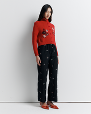The Lara Cardigan is a fitted, collared knit featuring delicate floral motifs and a timeless button-front design—perfect for layering with a touch of vintage charm.