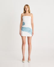 Crafted from a mid-weight linen fabric, offering a relaxed fitting shape, the Embroidered Mini Dress in White is the perfect warm-weather dress. Featuring adjustable spaghetti straps, straight neck design and tucks through the waist that create a flattering fit. Now available at www.romythebrand.com