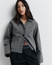 The Gabbi Jacket is a relaxed-fit outerwear piece crafted from soft vegan suede with a contrast pink twill lining. Designed with patch pockets, turn-back cuffs, and a four-button closure for effortless everyday style.