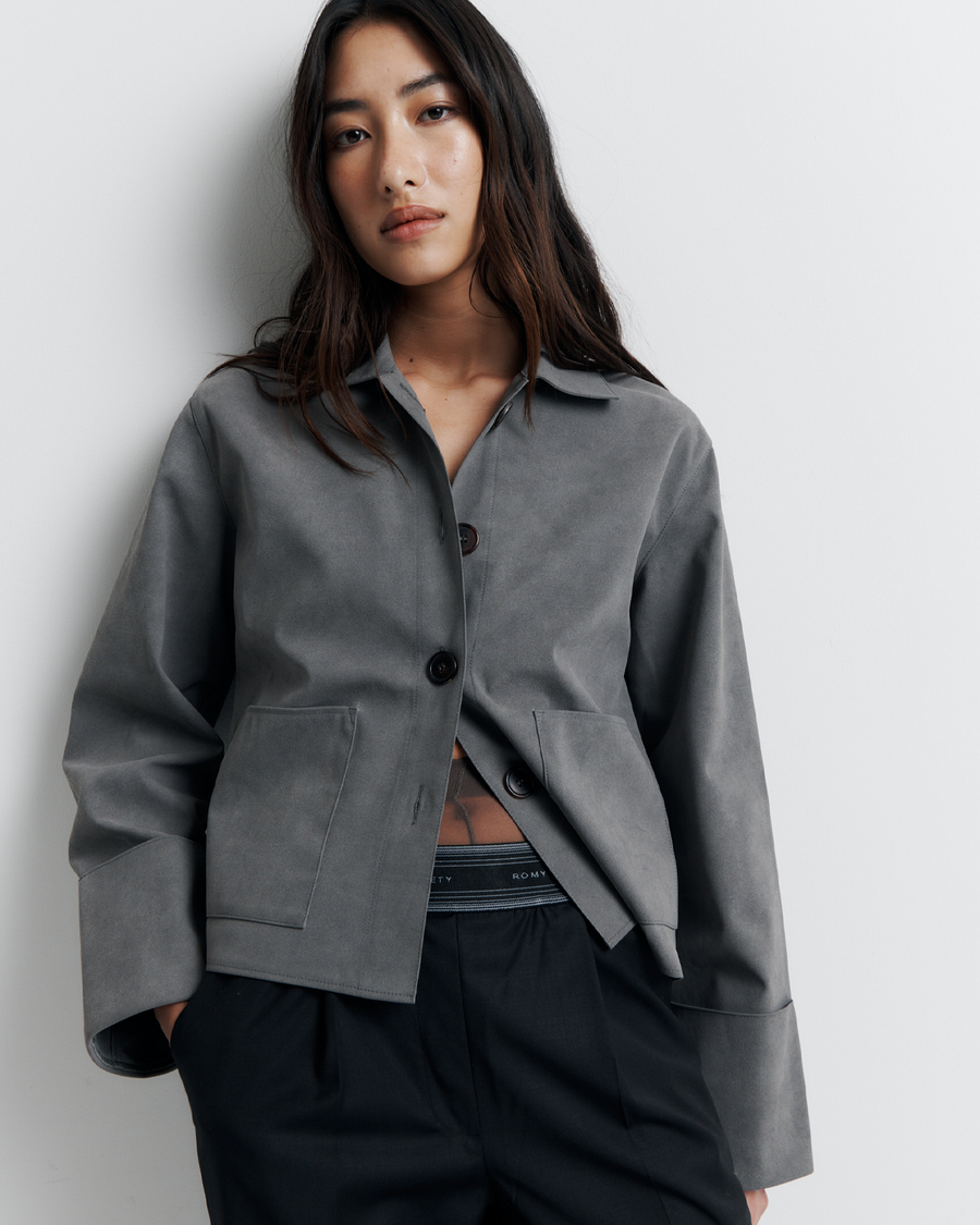 The Gabbi Jacket is a relaxed-fit outerwear piece crafted from soft vegan suede with a contrast pink twill lining. Designed with patch pockets, turn-back cuffs, and a four-button closure for effortless everyday style.