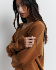 Ingrid Sweater: A relaxed V-neck knit crafted from a soft wool-cashmere blend. Features a slouchy fit with dropped shoulders and chunky ribbing for effortless, everyday comfort. Shop the look now.