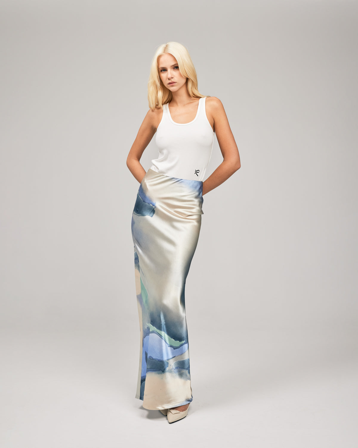 Crafted in a soft-satin fabrication, and in our exclusive print by Loralee Jade, the LJ Satin Maxi Skirt combines classical draping with a soft, pastell print. This floor length silhouette features an elastic waistband, concealed centre-back zip closure and a low waist. Now available at romythebrand.com