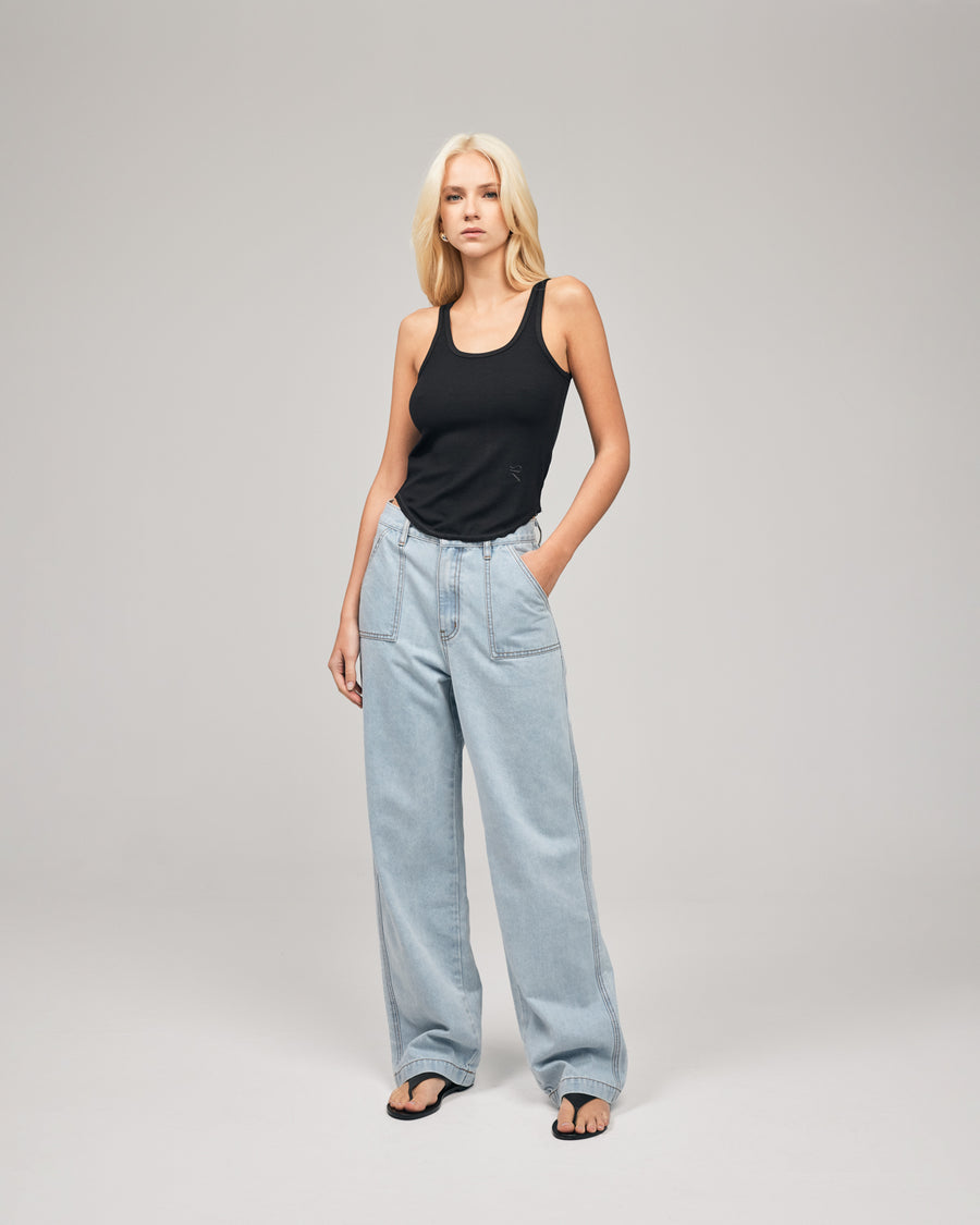 Straight-leg jean in medium wash with distressed details and frayed hem