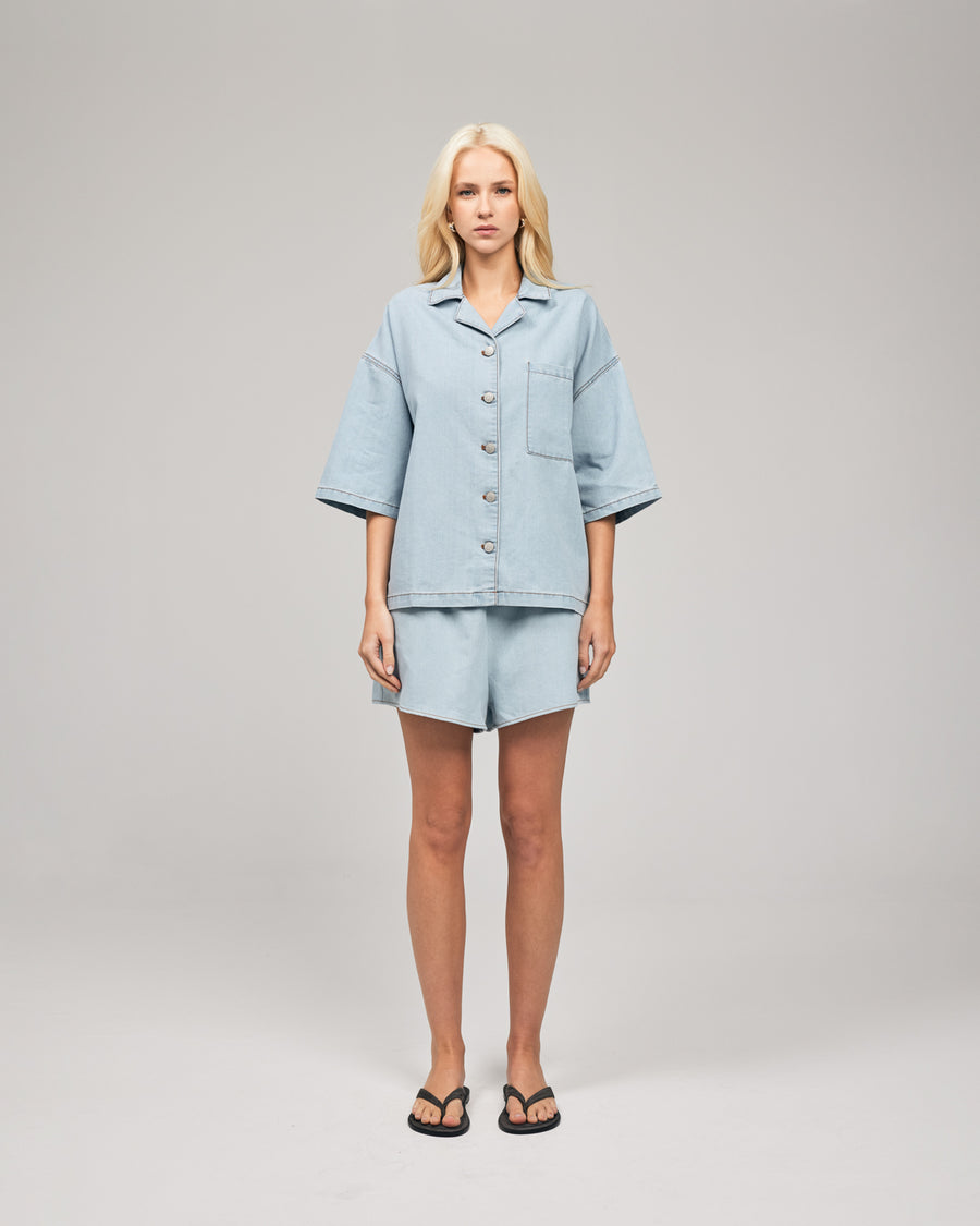 The Summer Short Sleeve Shacket is a take on a Romy Classic in a new chambray blue wash in a light cotton. It's an elevated take on your staple denim shirt that can be styled fastened or open over any dress or tank. Shop online at Romy now with Afterpay and free express shipping available.