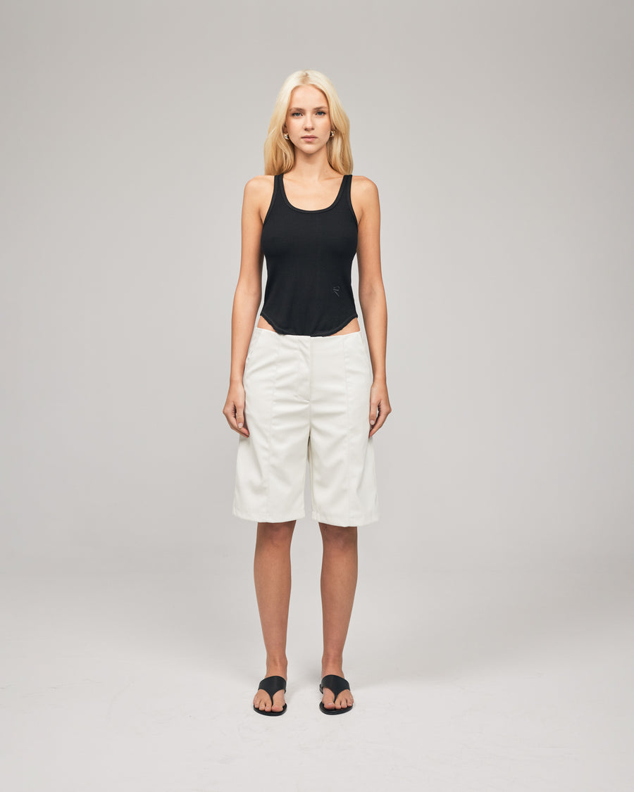 A tailored short cut in vegan leather featuring pin-tuck stitching through the front and relaxed fit, designed to be worn low waisted. Shop online at Romy now with Afterpay and free express shipping available.