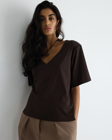 Clove Tee in brown, front close-up on model.