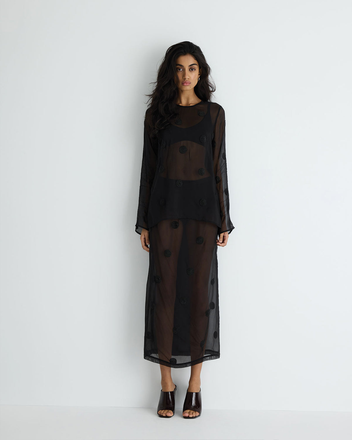 Sadie Skirt in black with hand beading, styled with matching top on model.