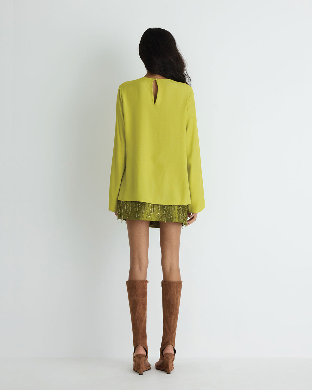 Elio Top in chartreuse, back view on model.