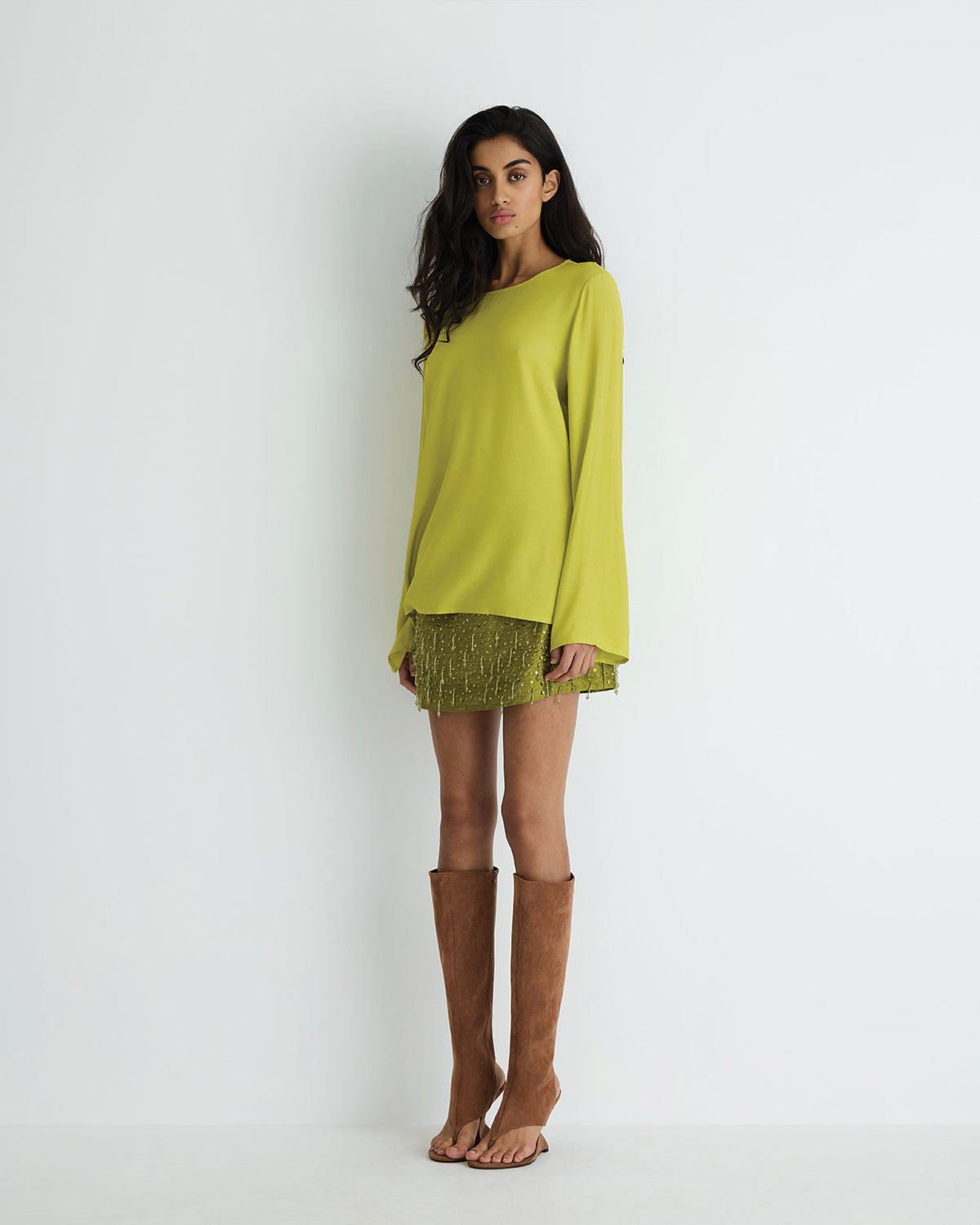 Elio Top in chartreuse, front view on model, alternate pose.