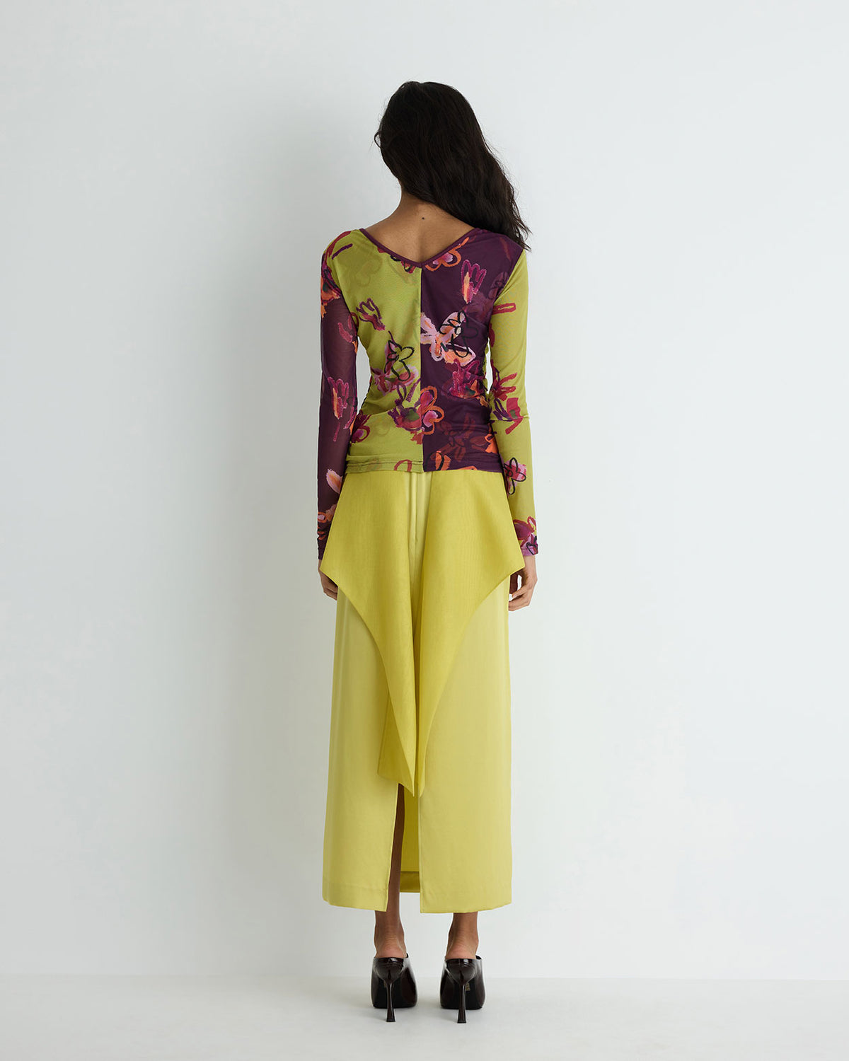 Faye Top in purple floral polyester mesh, back view on model.