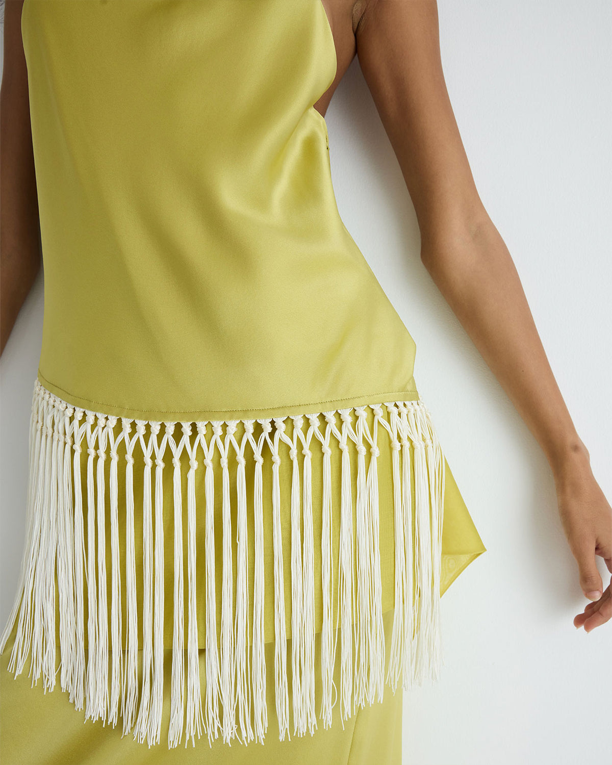 Helena Top in yellow silk, hand-knotted fringe detail.