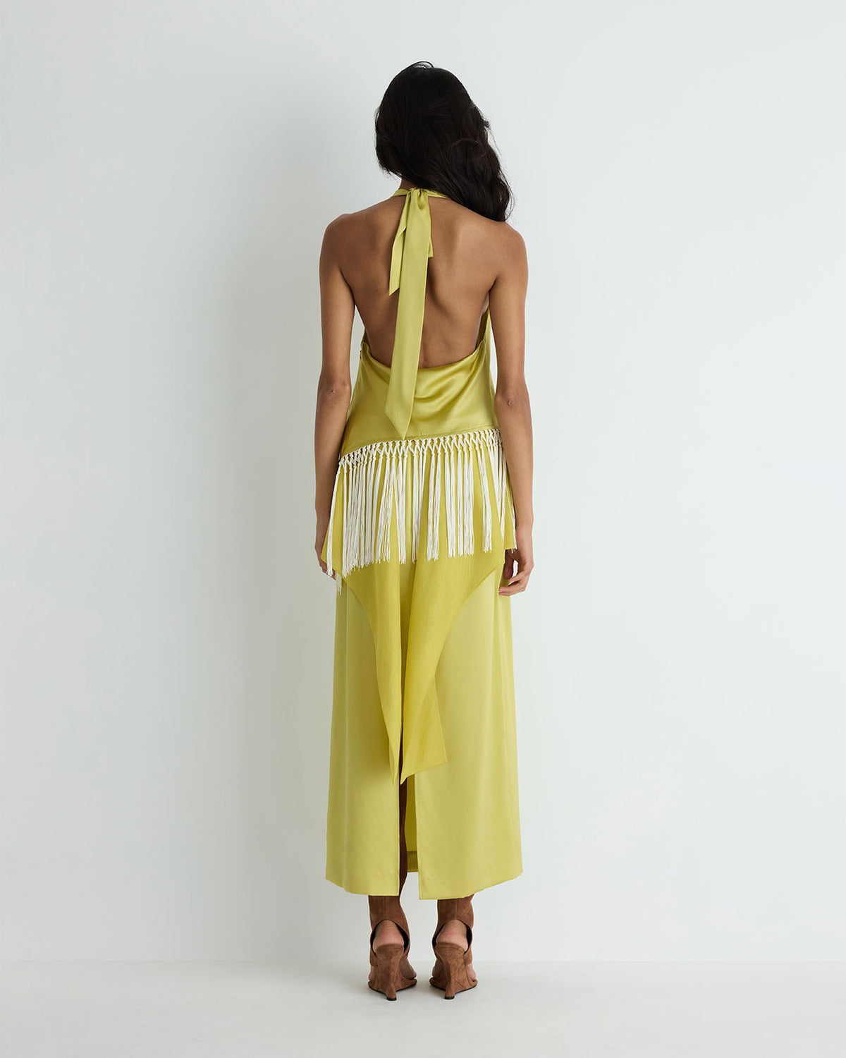 Helena Top in yellow silk, back view on model.