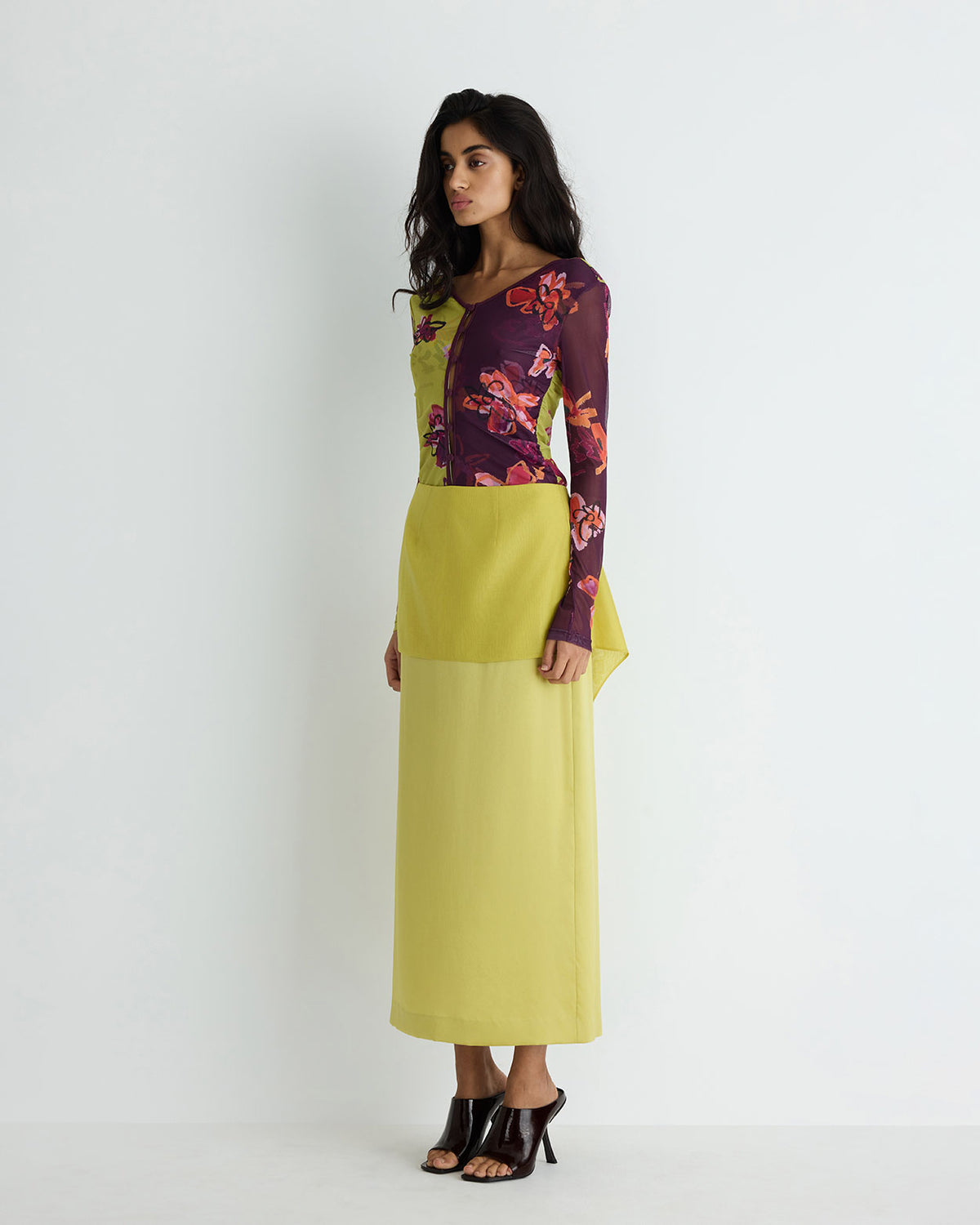 Lia Skirt in yellow silk, three-quarter view on model.