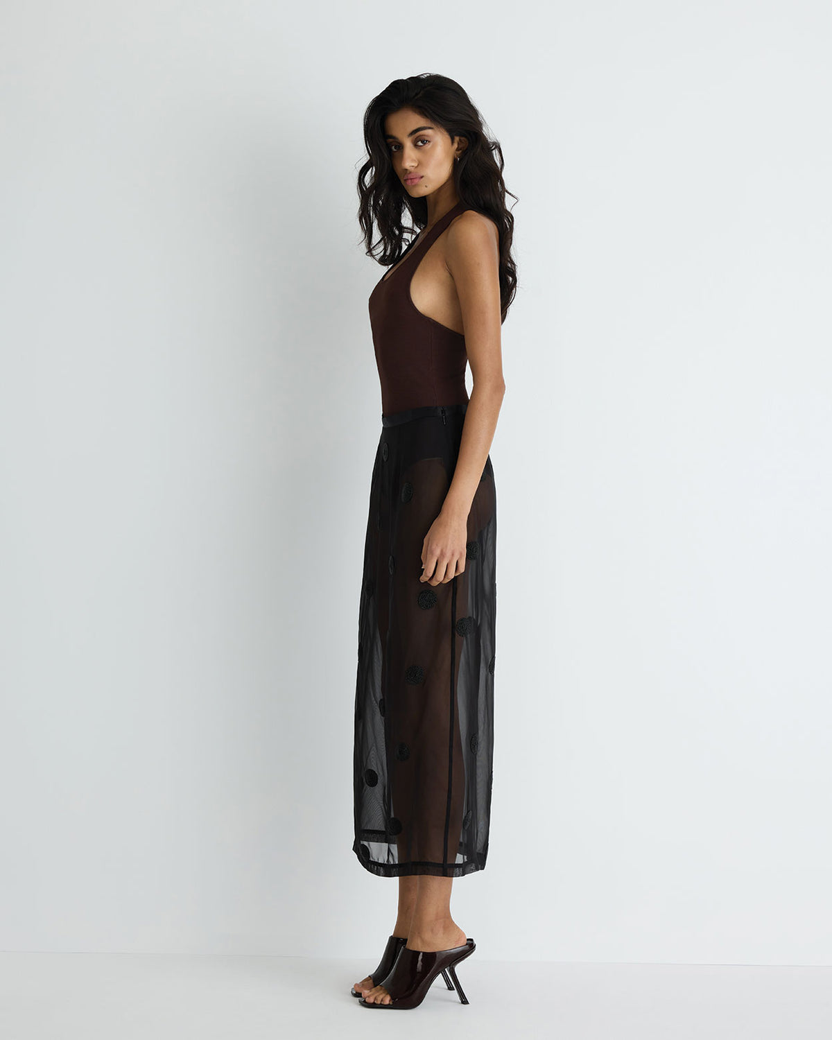 Sadie Skirt in black with hand beading, side view on model.