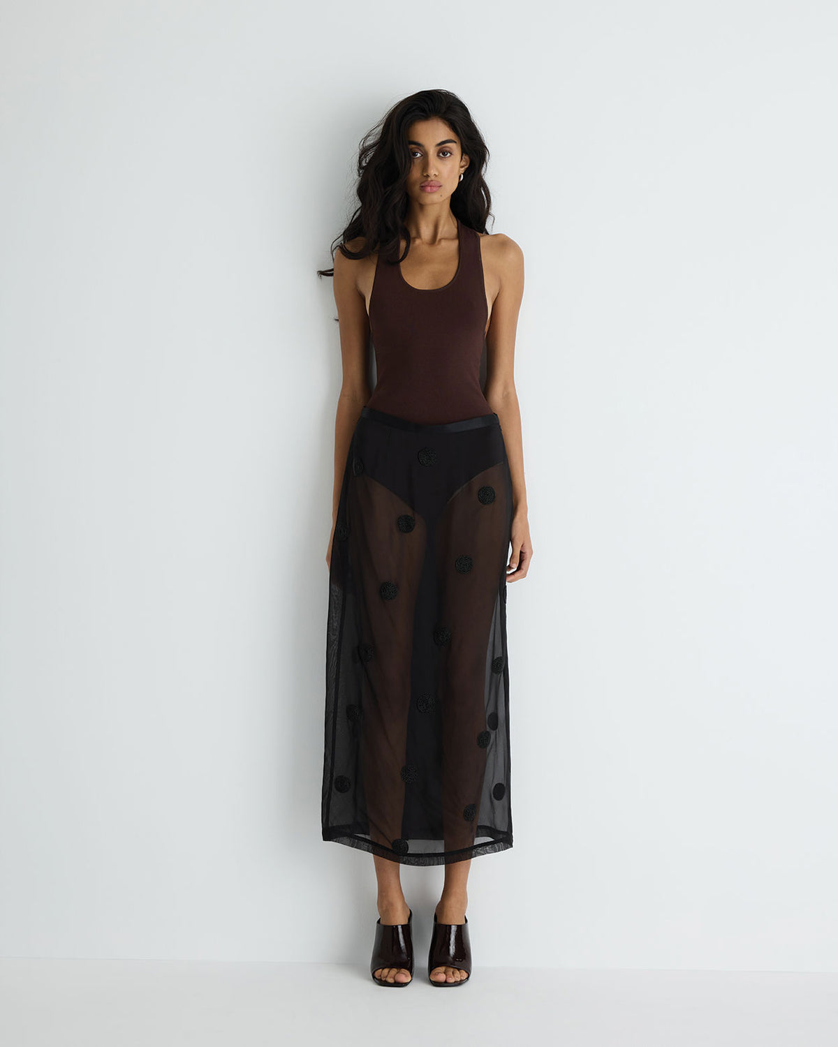 Sadie Skirt in black with hand beading, three-quarter view on model.