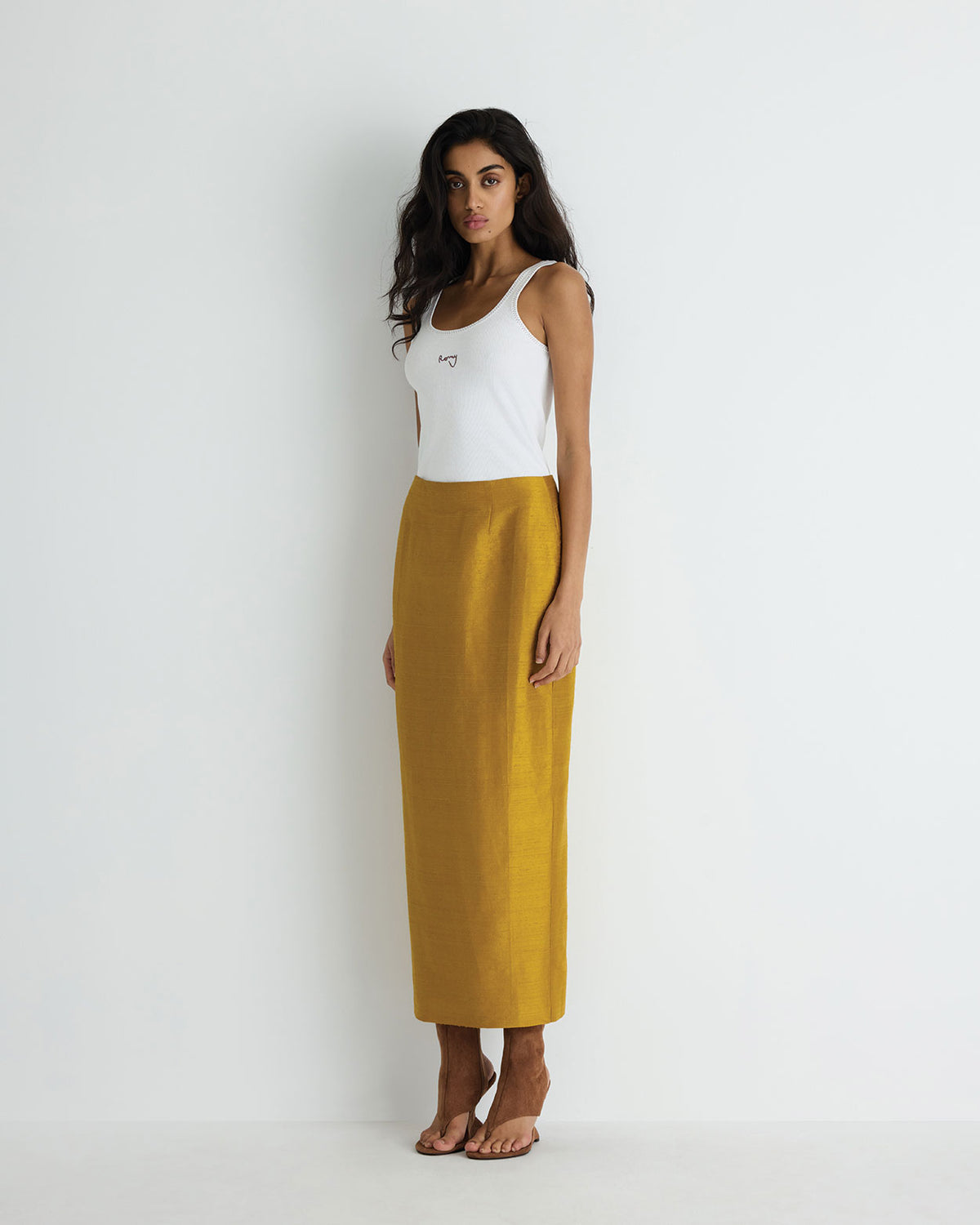 Veda Silk Skirt in gold, side view.