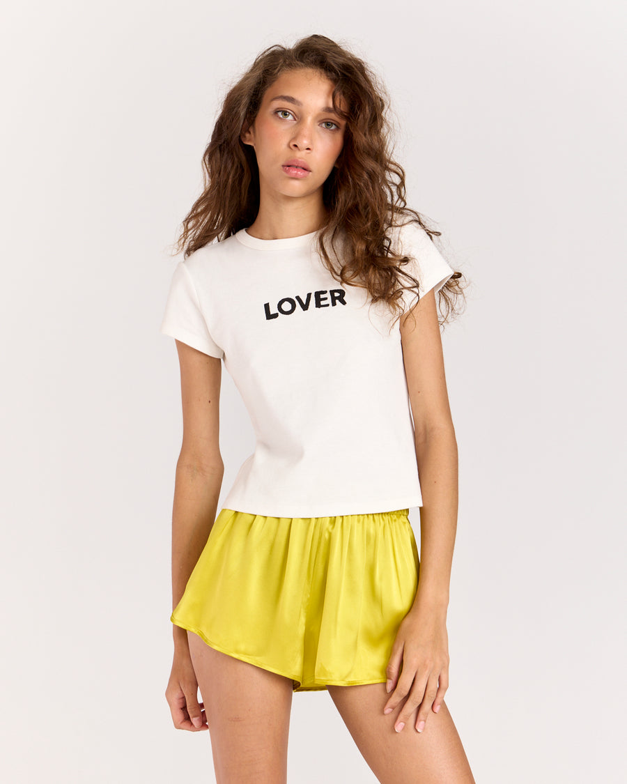 Discover the Lover Baby Tee, a timeless favorite with a classic crewneck, cropped silhouette, and fitted short-sleeve design. Crafted from 100% organic cotton for a super-soft feel, it's perfect for effortless everyday wear.