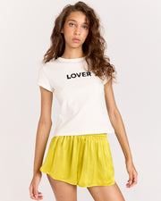 Discover the Lover Baby Tee, a timeless favorite with a classic crewneck, cropped silhouette, and fitted short-sleeve design. Crafted from 100% organic cotton for a super-soft feel, it's perfect for effortless everyday wear.