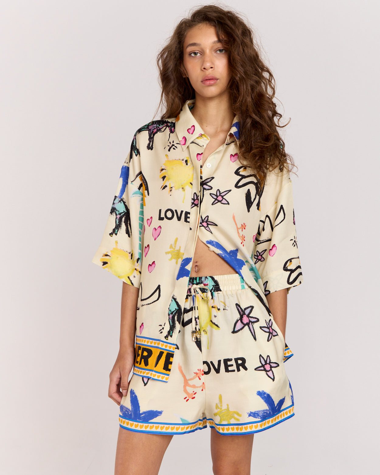 Experience effortless style with the Lover Shirt, featuring Jake Pedro's exclusive Lover Print. Crafted from a matte twill blend of viscose and recycled rayon, it drapes beautifully on the body with an oversized silhouette, relaxed shoulders, and a concealed placket for a sleek finish.