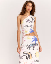 Turn heads with the Lover Dress, a one-shoulder design showcasing Jake Pedro's exclusive Lover Print. Crafted from a mid-weight linen blend, it features a chic waist cut-out, shirring, and an invisible side zip for a flawless fit.