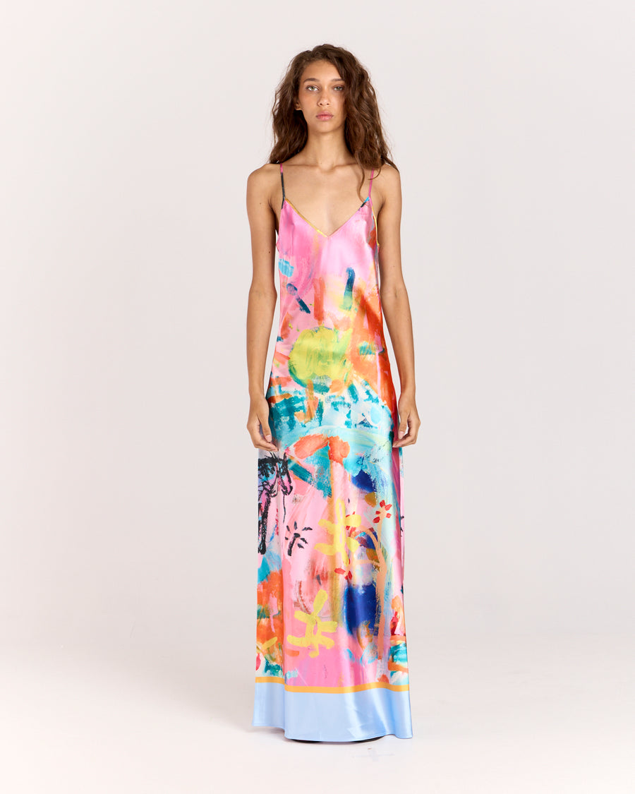 Discover the Rodeo Satin Maxi Dress, showcasing a limited-edition print by artist Jake Pedro. With a flattering V-neckline, adjustable straps, and a graceful floor-length hem, this luxurious satin dress with a subtle sheen is perfect for effortlessly transitioning from day to evening.