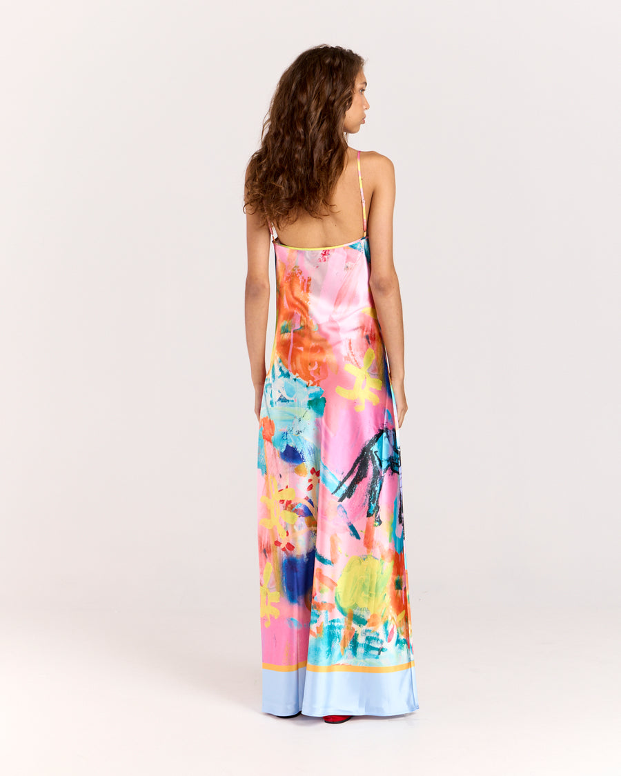 Discover the Rodeo Satin Maxi Dress, showcasing a limited-edition print by artist Jake Pedro. With a flattering V-neckline, adjustable straps, and a graceful floor-length hem, this luxurious satin dress with a subtle sheen is perfect for effortlessly transitioning from day to evening.