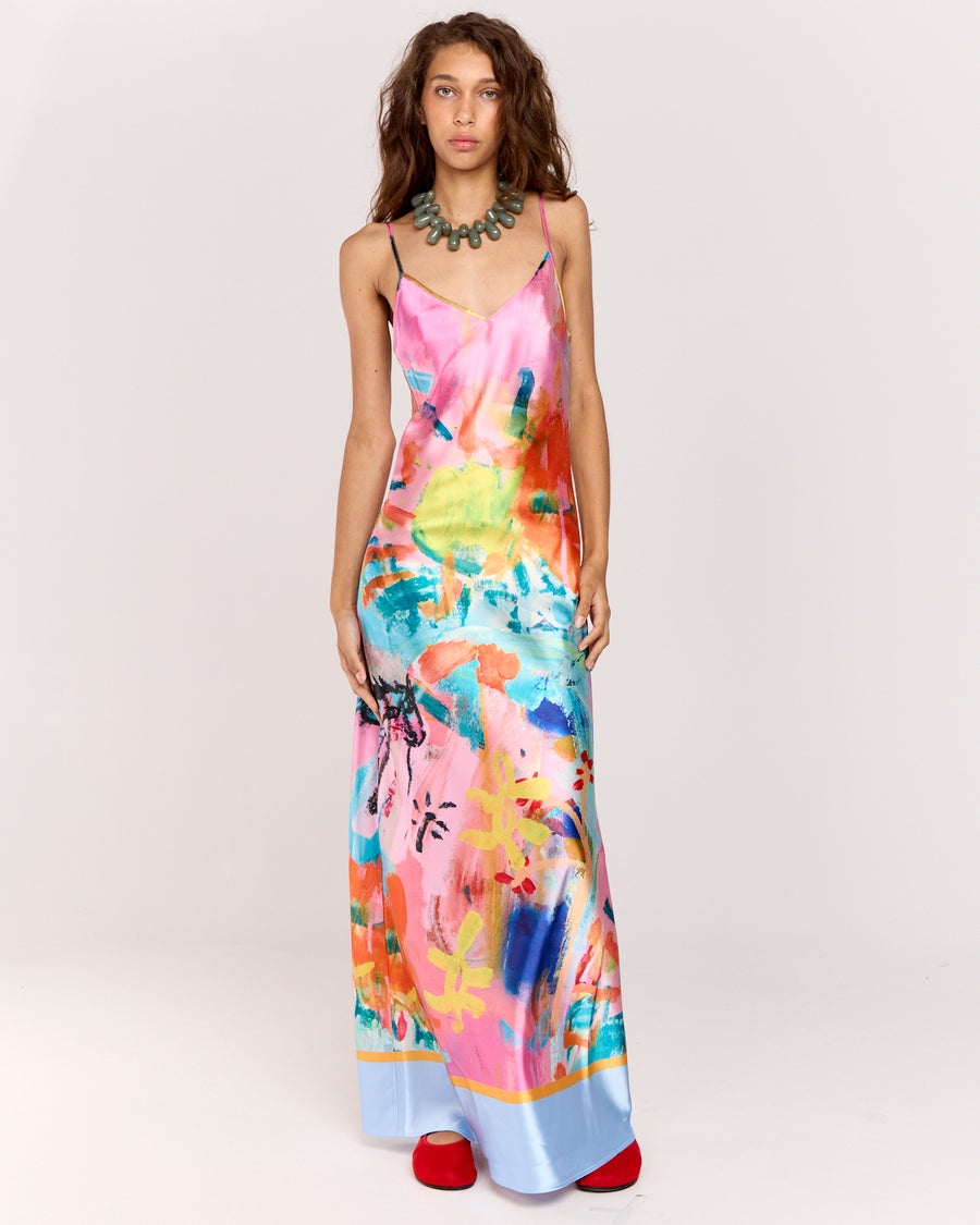 Discover the Rodeo Satin Maxi Dress, showcasing a limited-edition print by artist Jake Pedro. With a flattering V-neckline, adjustable straps, and a graceful floor-length hem, this luxurious satin dress with a subtle sheen is perfect for effortlessly transitioning from day to evening.