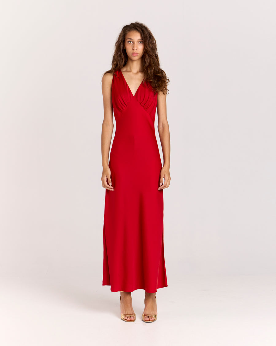 Shop the Alexis Dress, a chic bias-cut V-neck maxi dress with delicate gathering at the bust. Made from lightweight fabric that softly skims the body, this effortless slip-on style offers elegance and comfort for any occasion. 