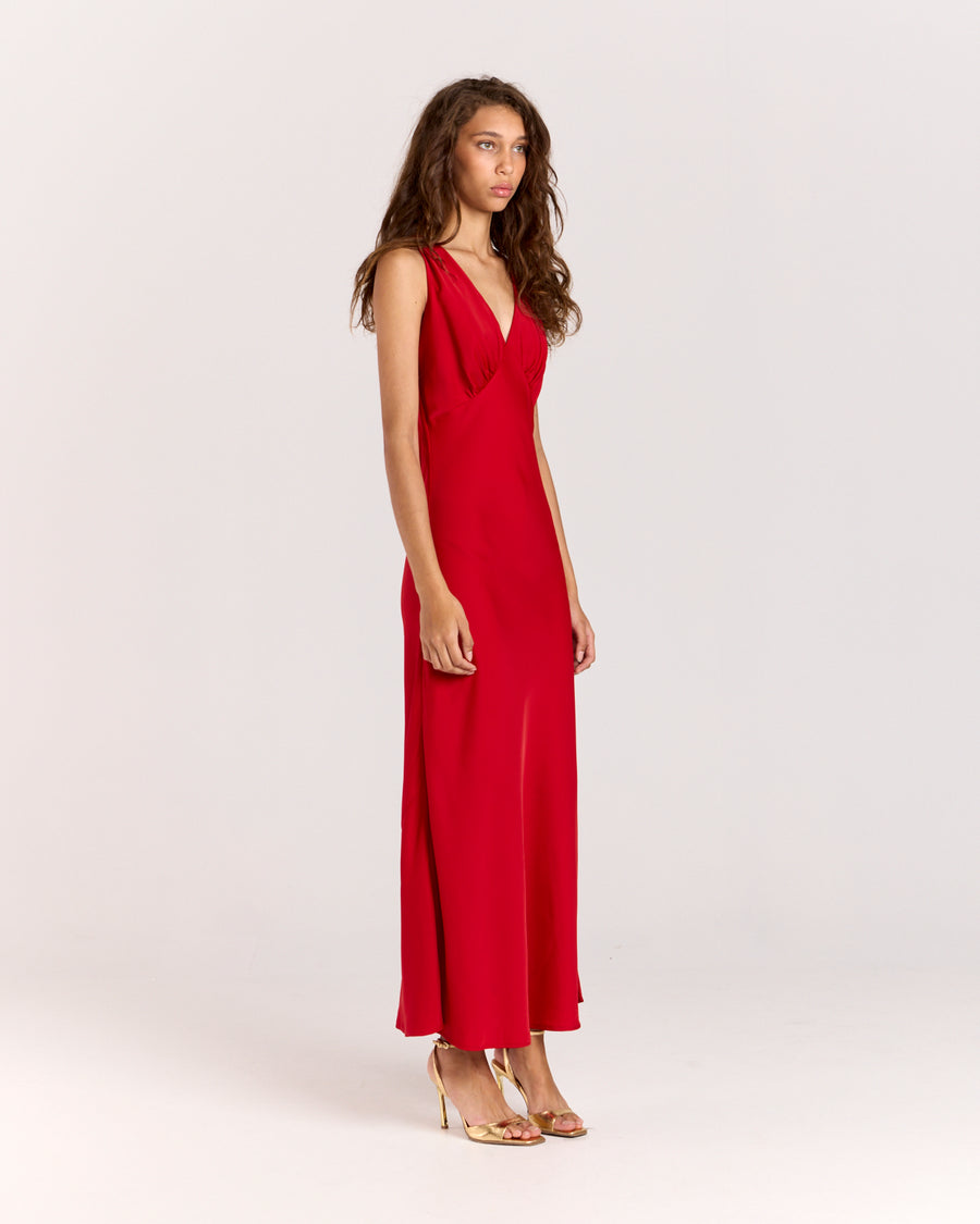 Shop the Alexis Dress, a chic bias-cut V-neck maxi dress with delicate gathering at the bust. Made from lightweight fabric that softly skims the body, this effortless slip-on style offers elegance and comfort for any occasion. 