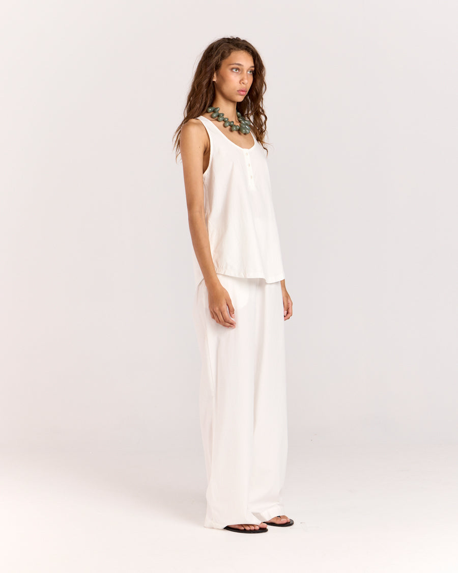 Introducing the Summer Tank, featuring an elegant scoop neckline adorned with self-covered buttons. Cut in an off-the-body, relaxed silhouette, this tank is crafted from beautifully soft cotton-tencel fabric that moves effortlessly with you, making it a perfect addition to your warm-weather wardrobe.